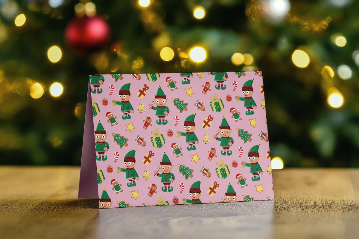 Greeting card with the elf pattern in front of holiday lights